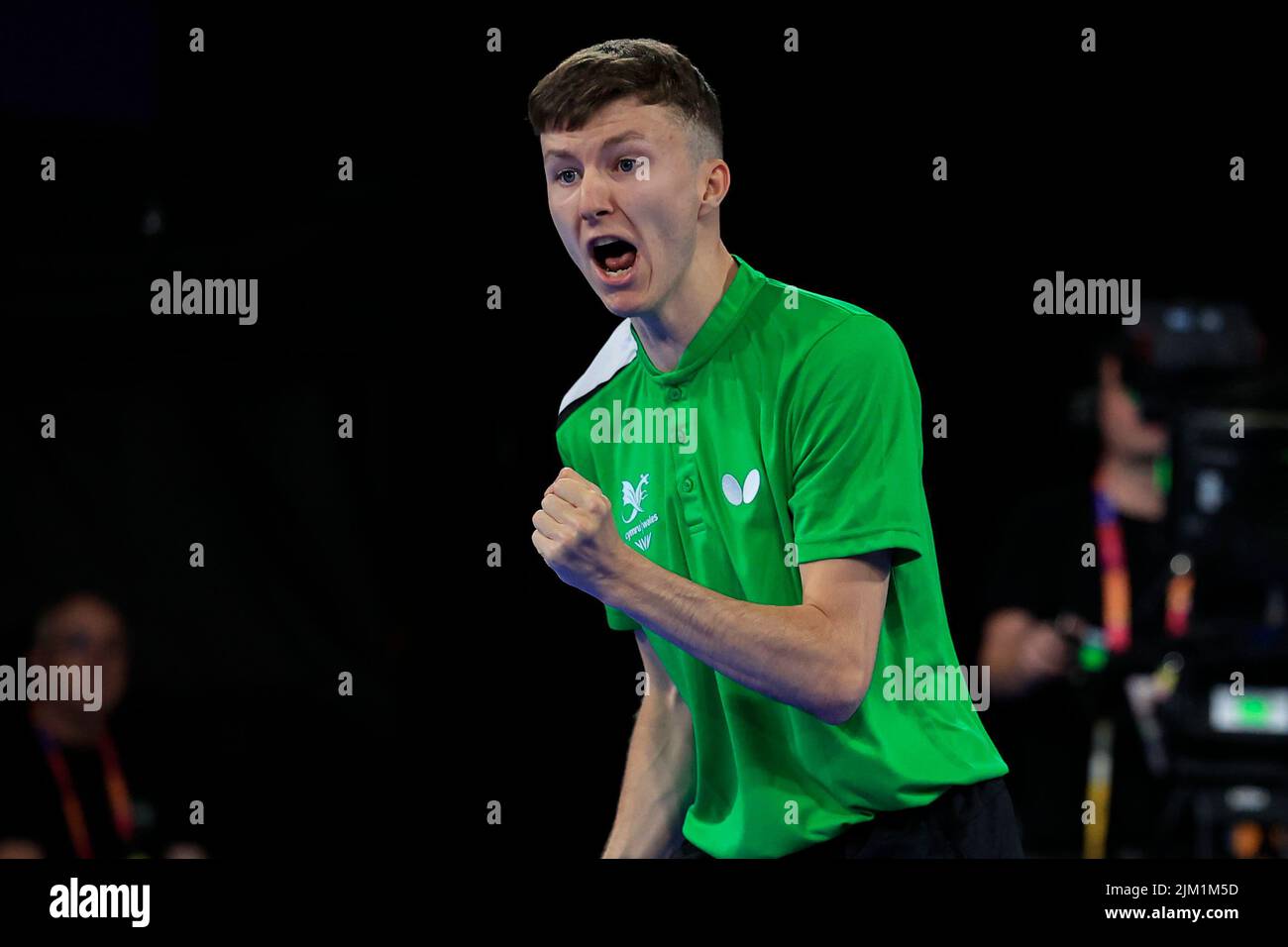 Callum Evans of Wales cheers a game against Sam Walker and Maria