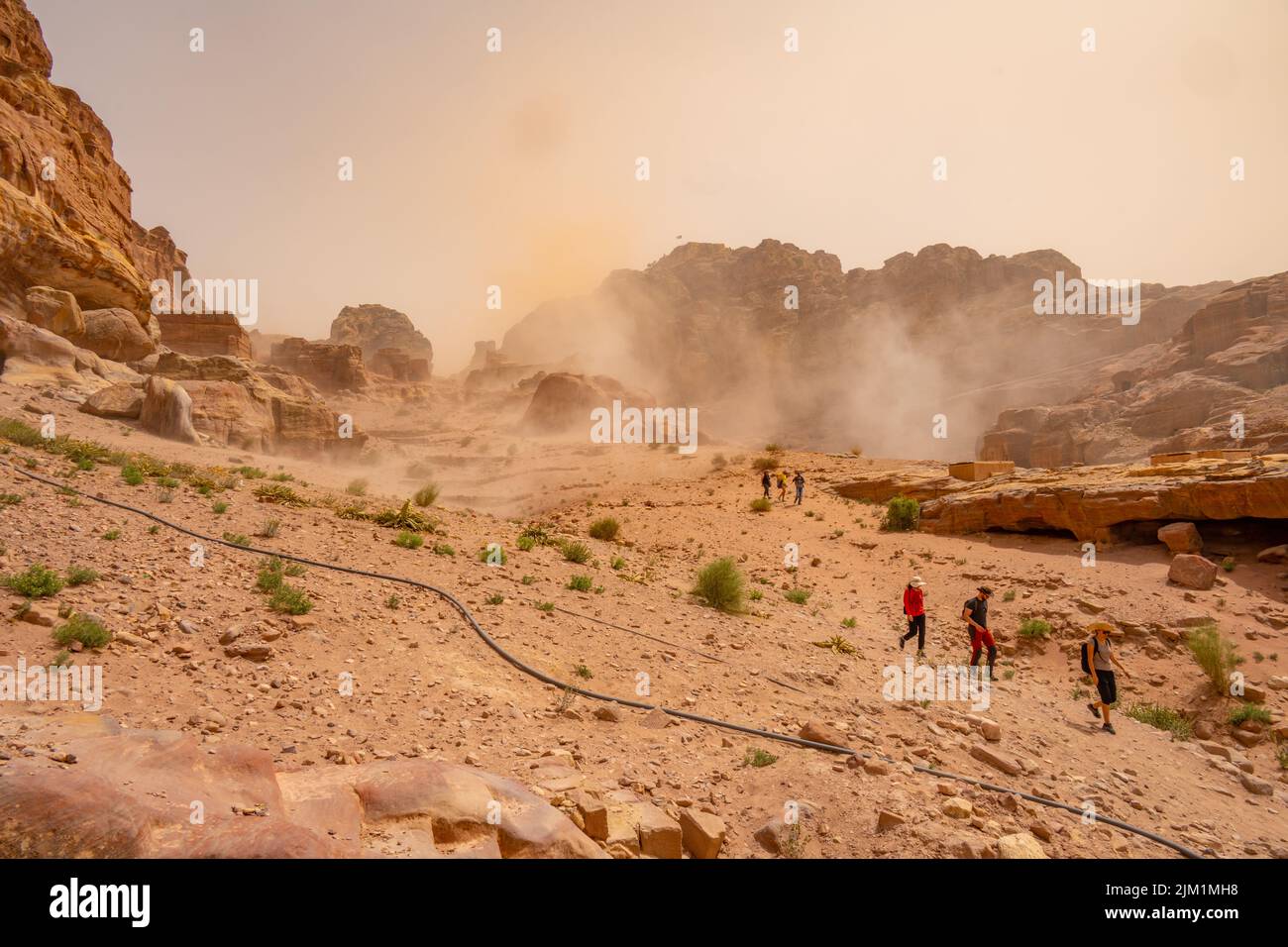 Outside the royal Tombs  Petra Jordan. With a dust storm blowing through Stock Photo
