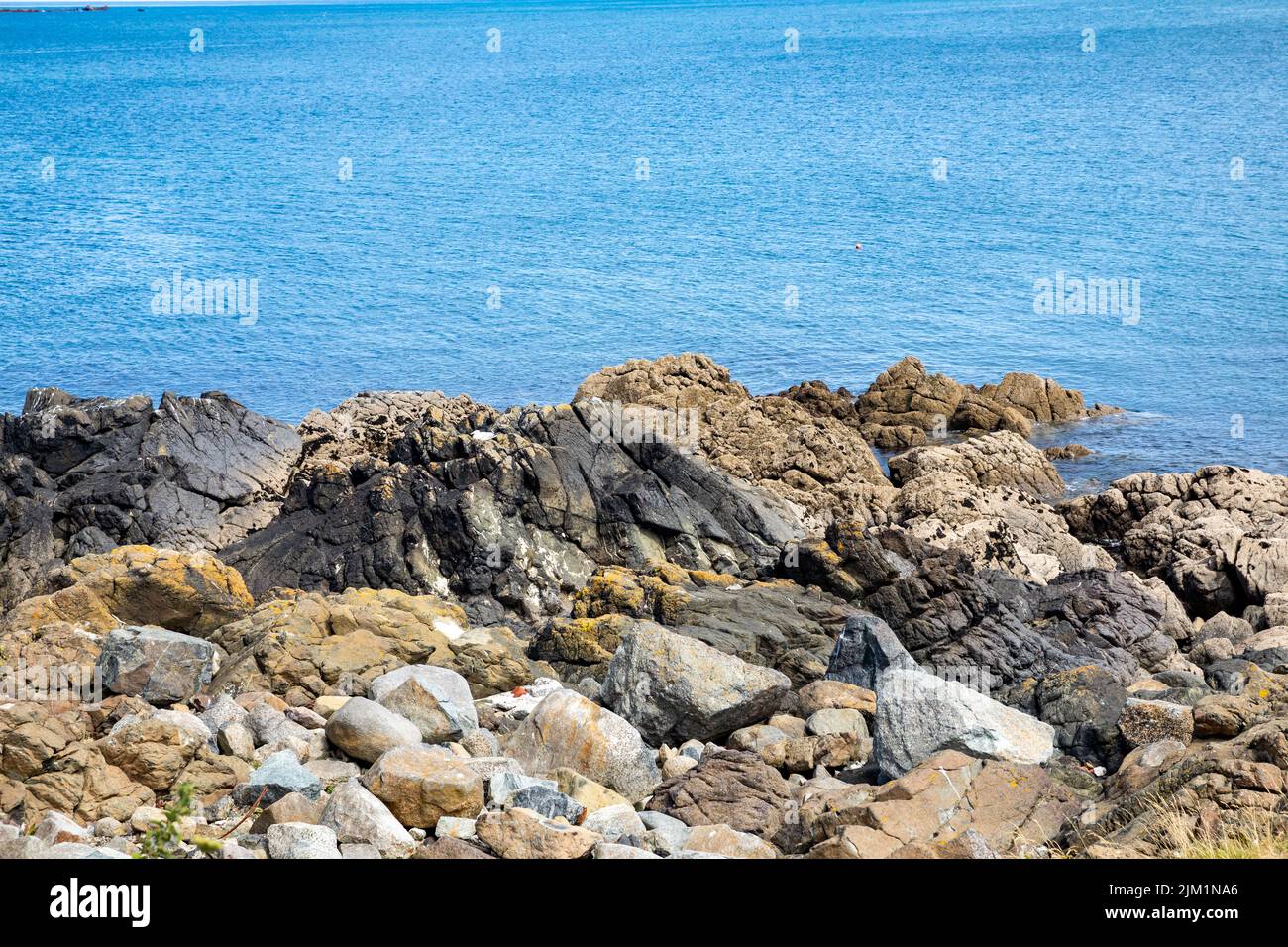 A view across the rocks in Coverack Bay, Cornwall,UK Stock Photo