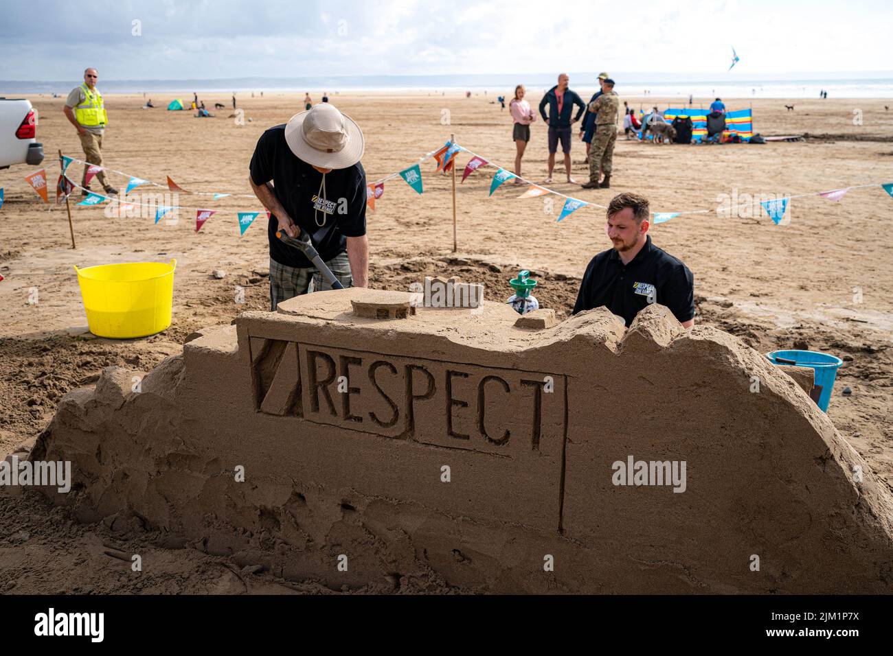 EDITORIAL USE ONLY A sand sculpture on Saunton Sands beach in Devon as part of the Defence Infrastructure Organisation (DIO) Respect the Range campaign, warning holidaymakers and locals to check military firing and training times when accessing Ministry of Defence (MOD) sites this summer. Issue date: Thursday August 4, 2022. Stock Photo
