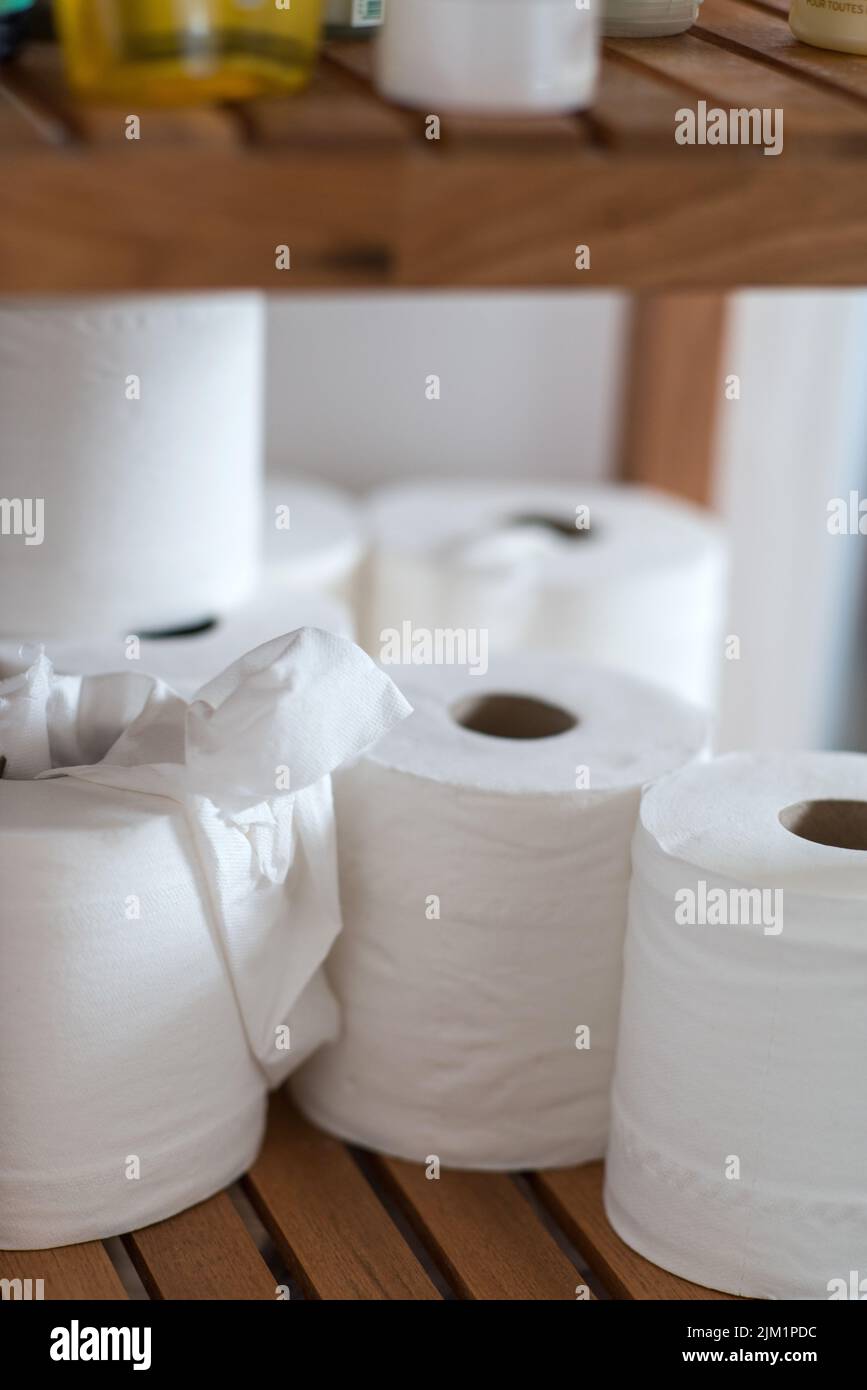 Toilet rolls ion bathroom shelf Stock Photo