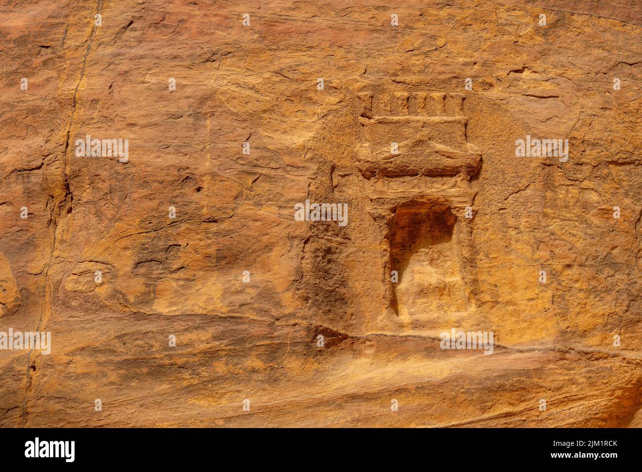 Nabatean rock carvings in Al-Siq the canyon entrance to Petra Jordan. Stock Photo