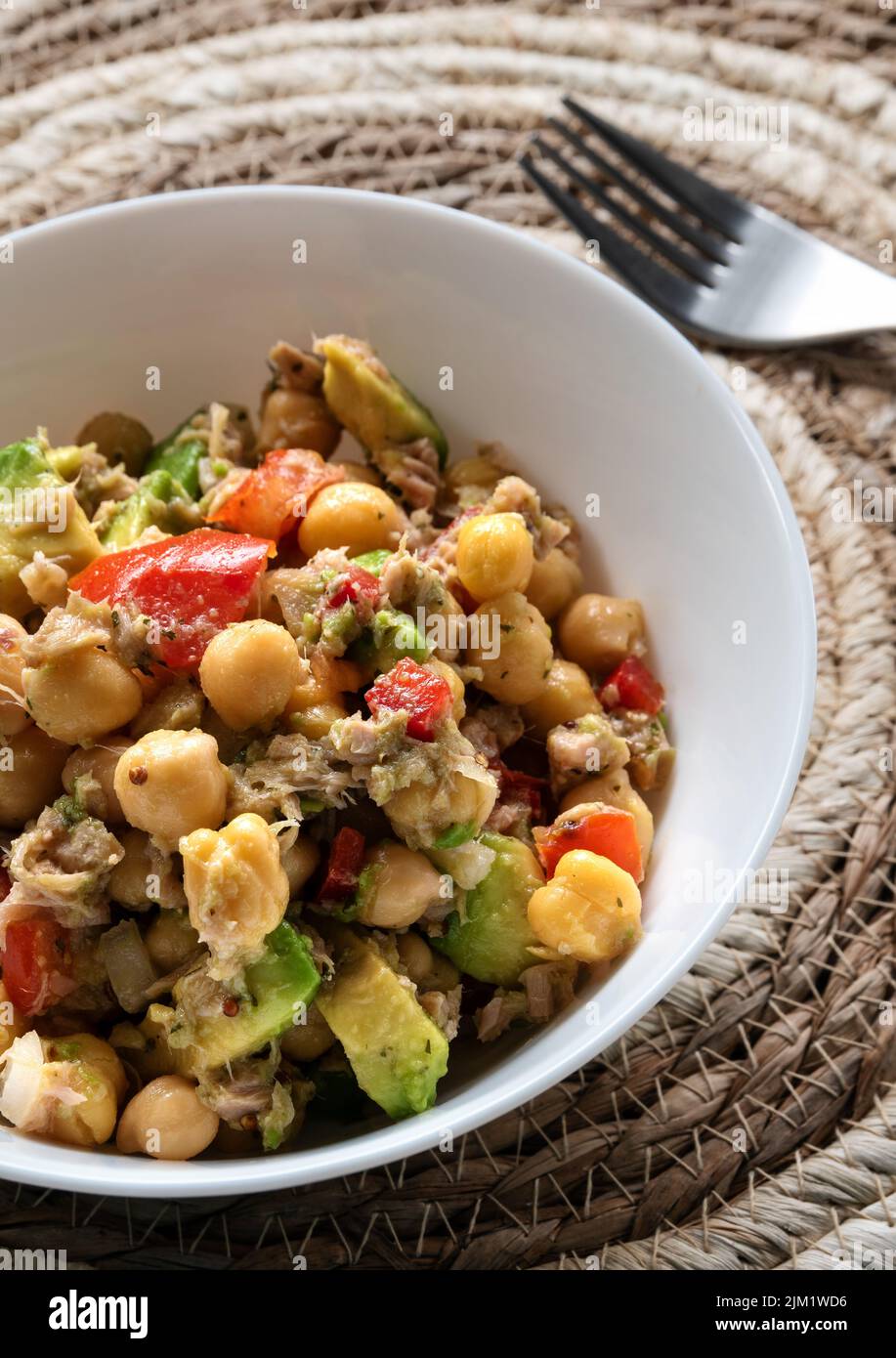 Fresh chickpea salad with tuna, tomato, pepper, onion and avocado Stock