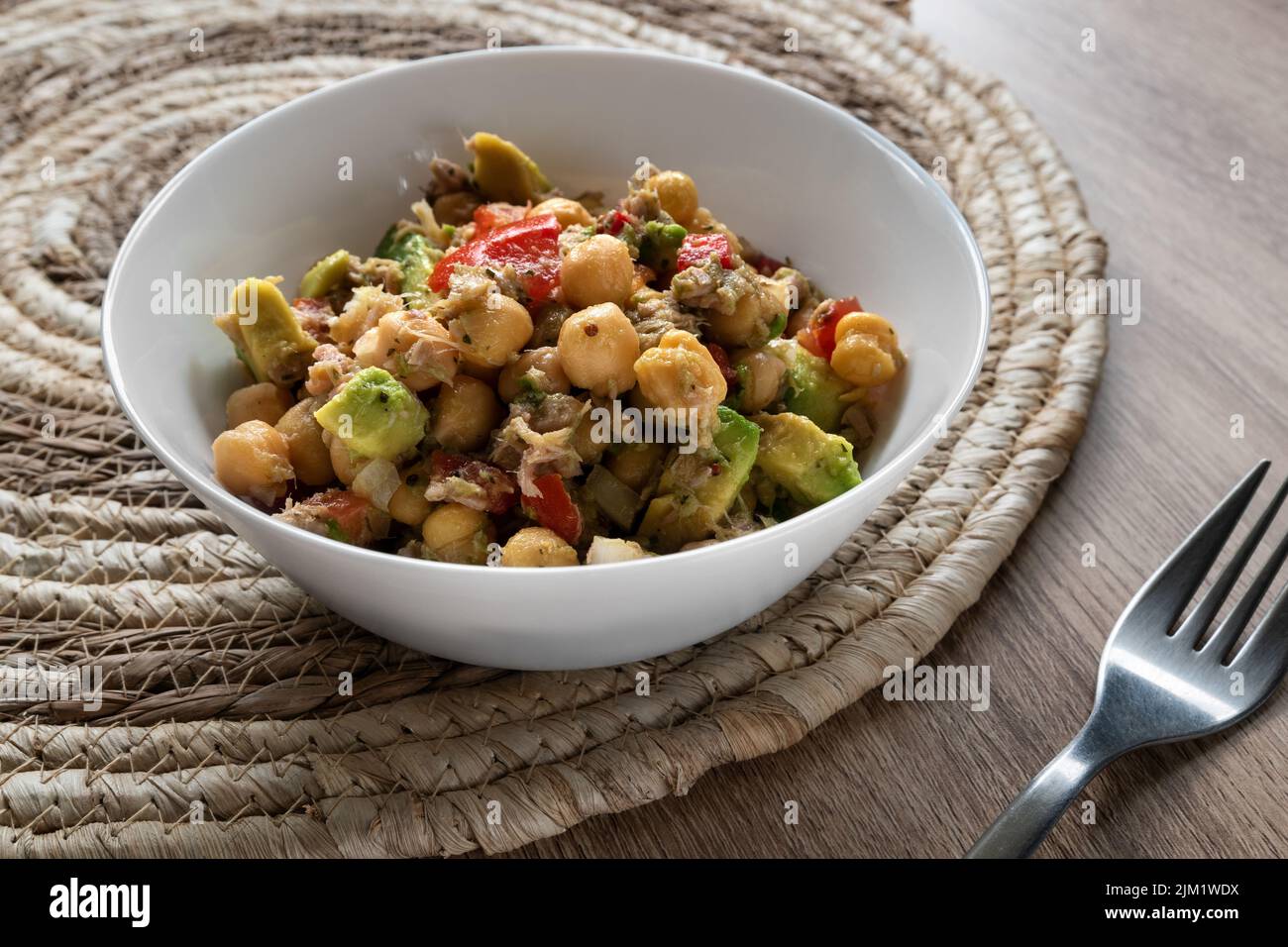 Fresh chickpea salad with tuna, tomato, pepper, onion and avocado Stock