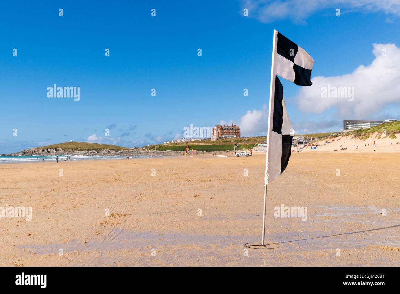A black and white chequered flag on Fistral Beach in Newquay in Cornwall in England in the UK. Stock Photo