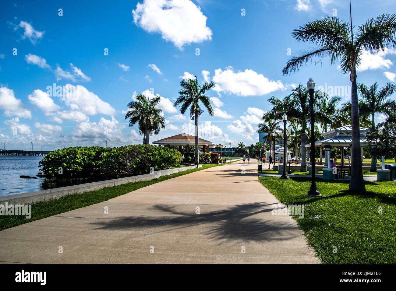 Harborwalk waterfront multi-use path in Punta Gorda, Florida, Charlotte County, Barron Collier Bridge seen in the distance. Parks and outdoor activity Stock Photo