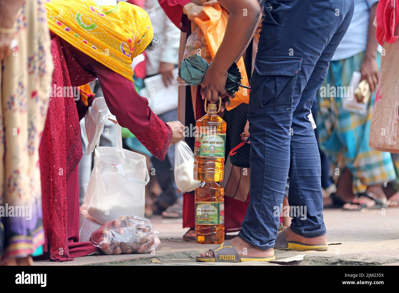 Overcrowding of people at the TCB biponon kendra [food sell center] in Ward No. 10 of Motijheel in the capital to collect products,Bangladesh. As the Stock Photo