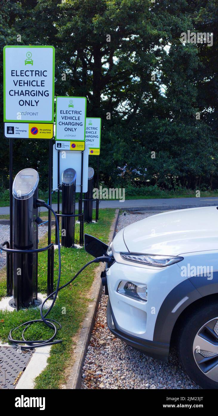 Cornwall, UK - Electric vehicle charging at a Podpoint EV charger at the University of Exeter, Penryn Campus. Stock Photo