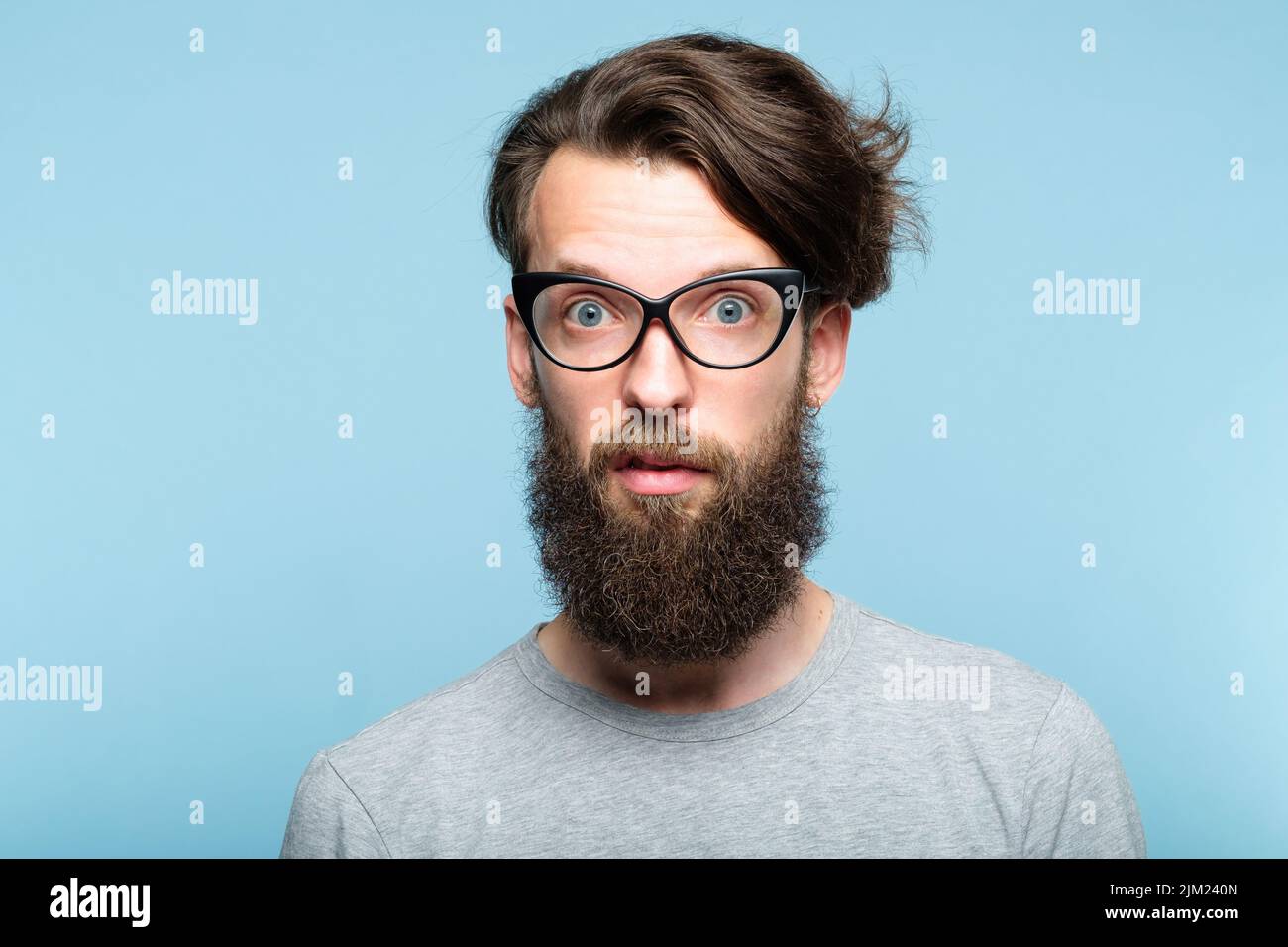 yuck disgusted bearded hipster glasses quirky man Stock Photo