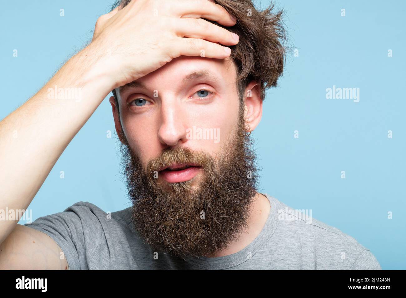tired exhausted man clutch head fatigue overwork Stock Photo Alamy