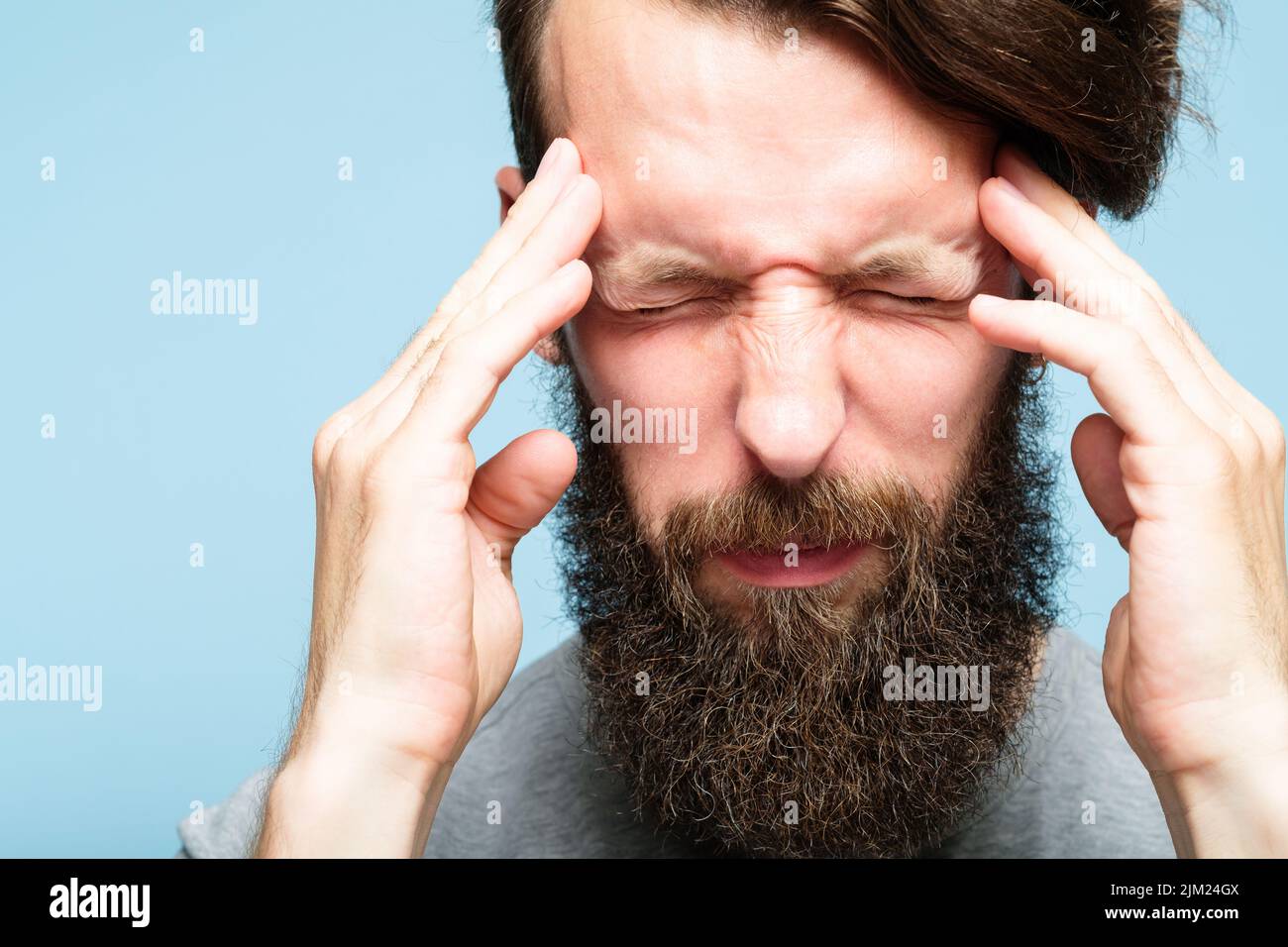 headache migraine man pain discomfort stress Stock Photo