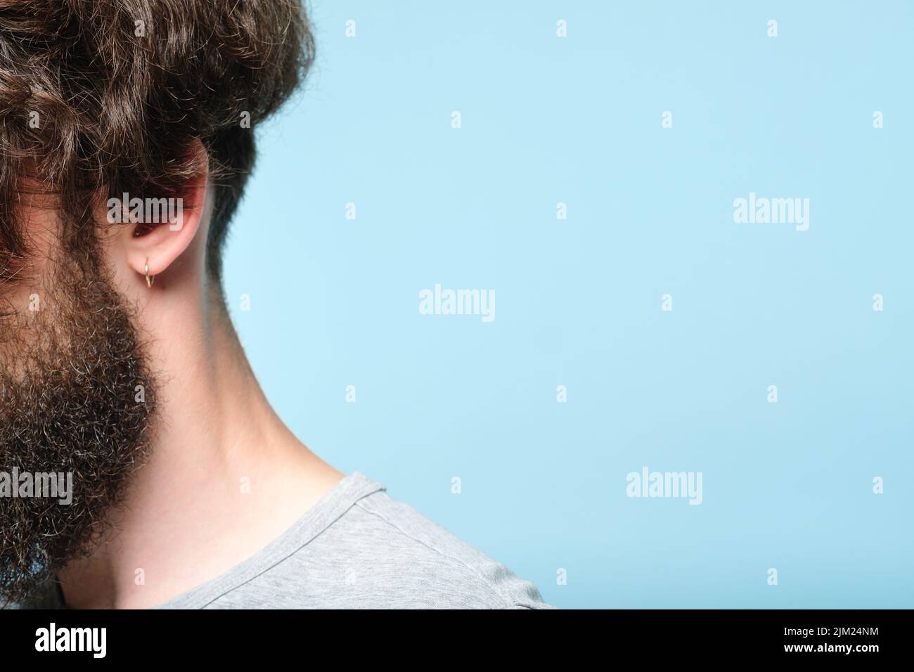 back neck curly dark haired bearded man barbershop Stock Photo