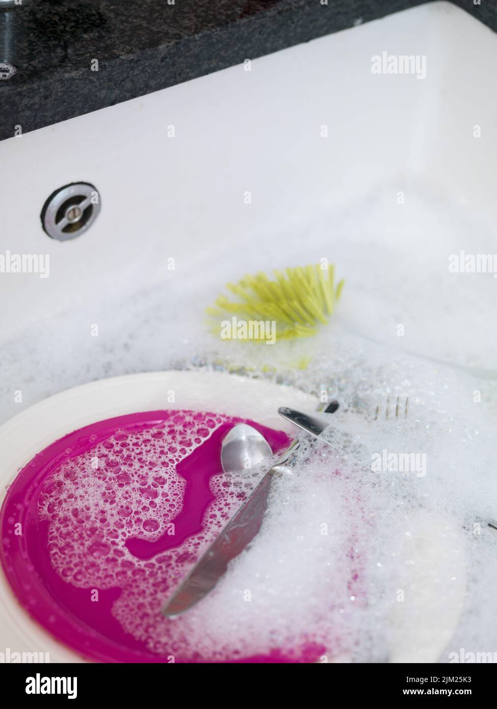 Washing up in sink Stock Photo Alamy