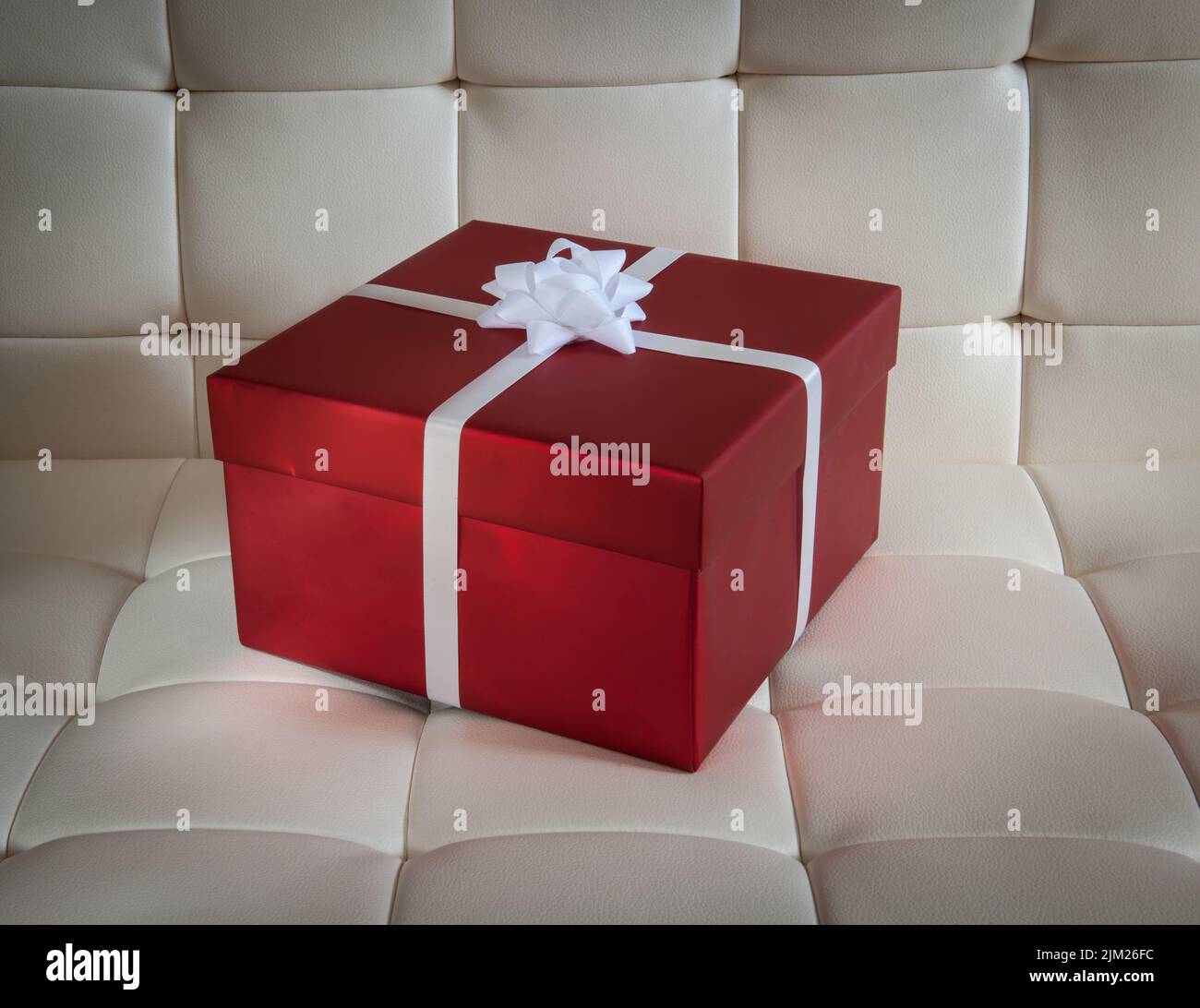 Wrapped present on chair Stock Photo