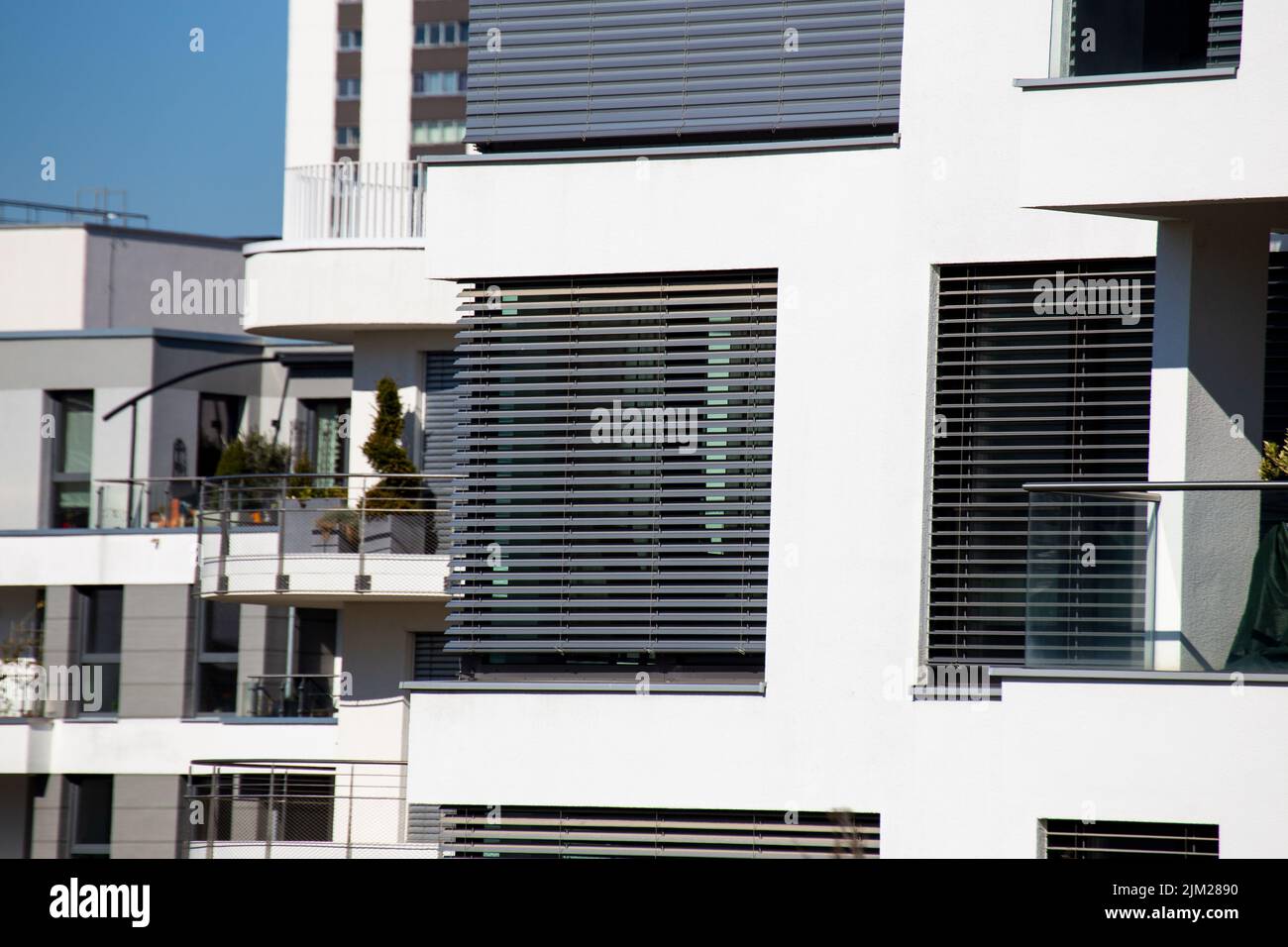 Windows with modern blinds on a new apartment building Stock Photo
