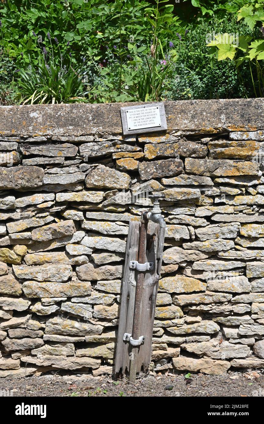 A disused water tap can be found by the wall of a house in the Gloucestershire hamlet of Adlestrop. This tap was the source of fresh water for the res Stock Photo