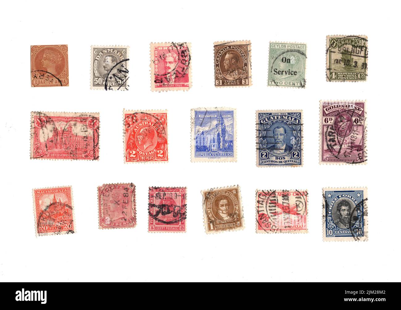 A selection of old postage stamps from around the world on a white