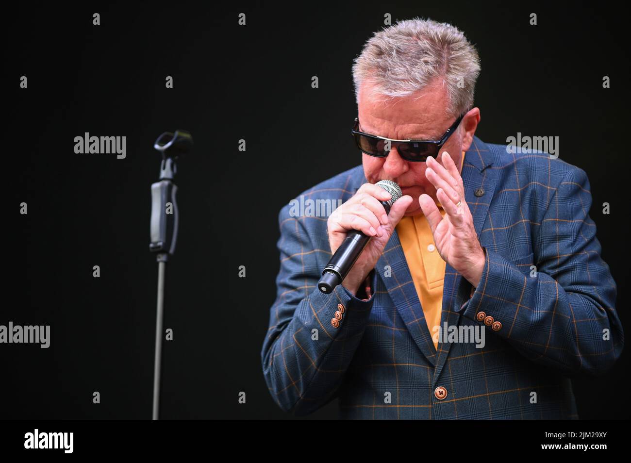 Lead Singer, Graham McPherson, known by his stage name Suggs, performs
