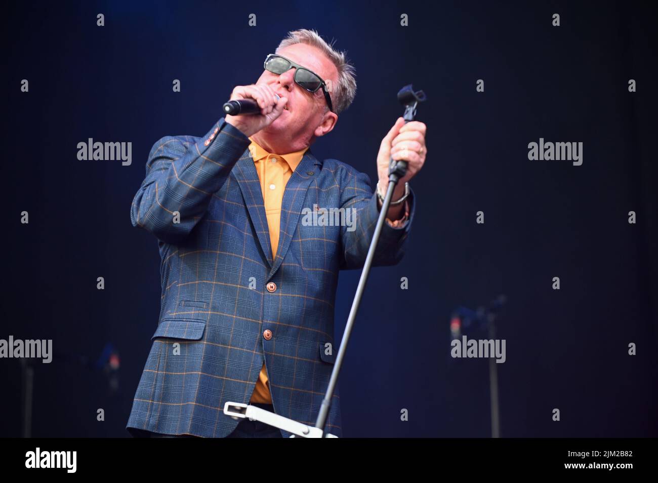 Lead Singer, Graham McPherson, known by his stage name Suggs, performs