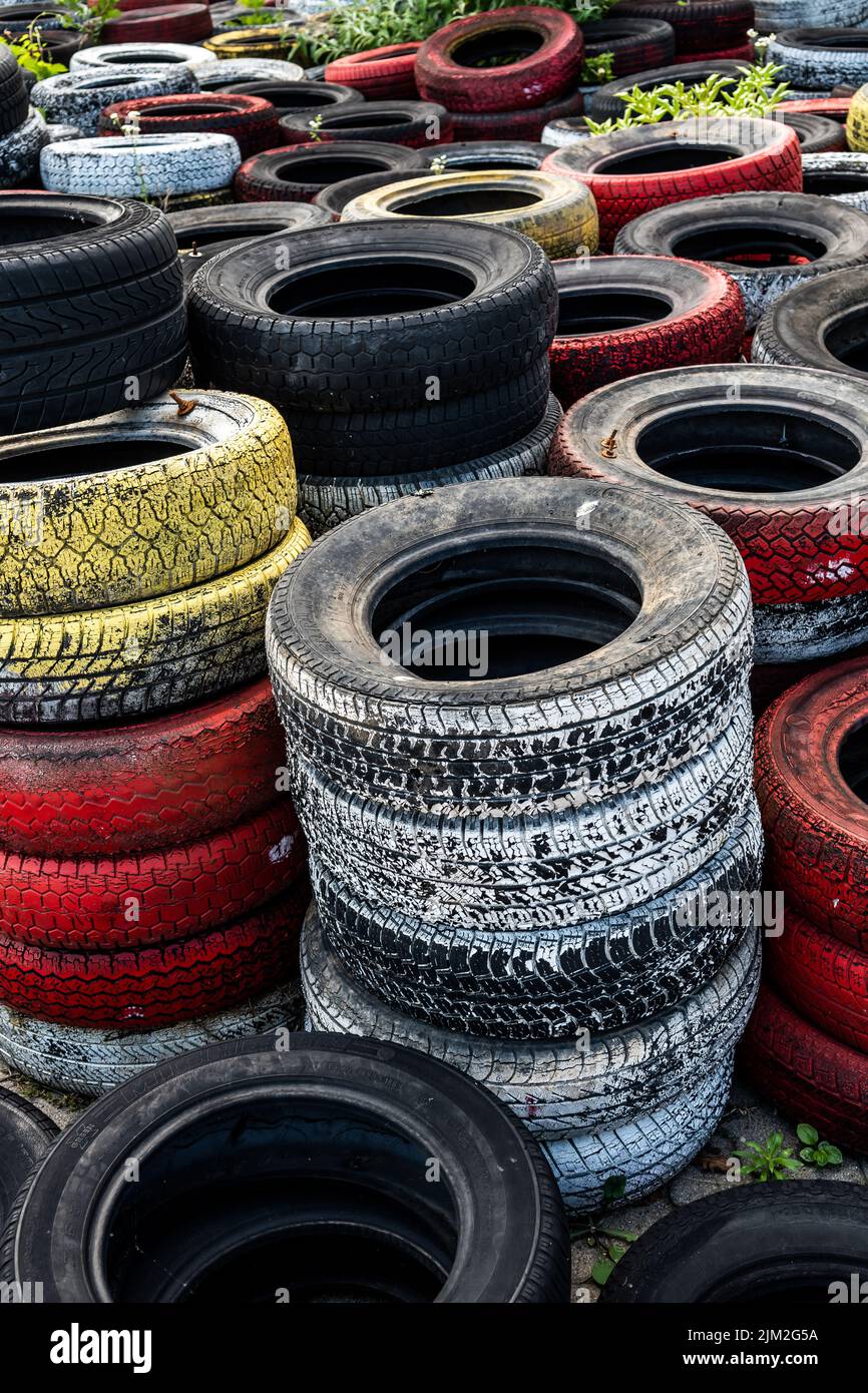 Pile Of Old Used Car And Bike Tyres Representing Hazardous Waste And