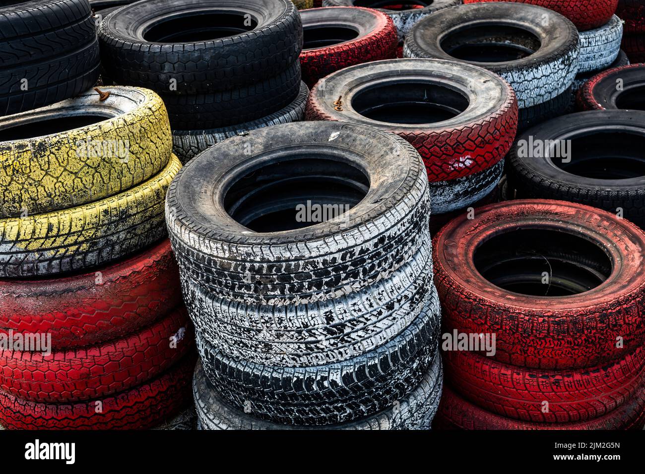 Pile Of Old Used Car And Bike Tyres Representing Hazardous Waste And