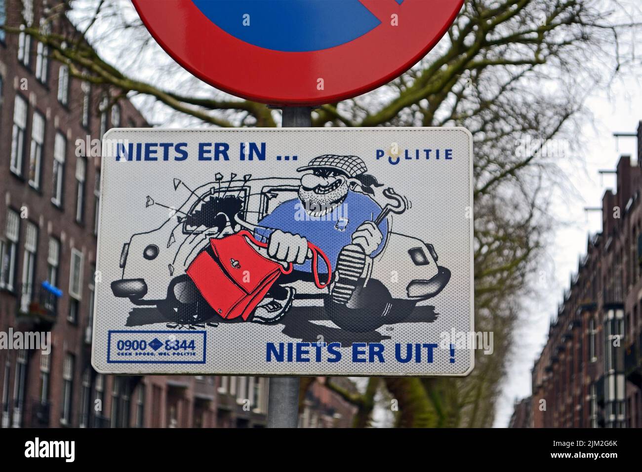 Attention! auto thief activity as road sign in Amsterdam, Netherlands. Stock Photo