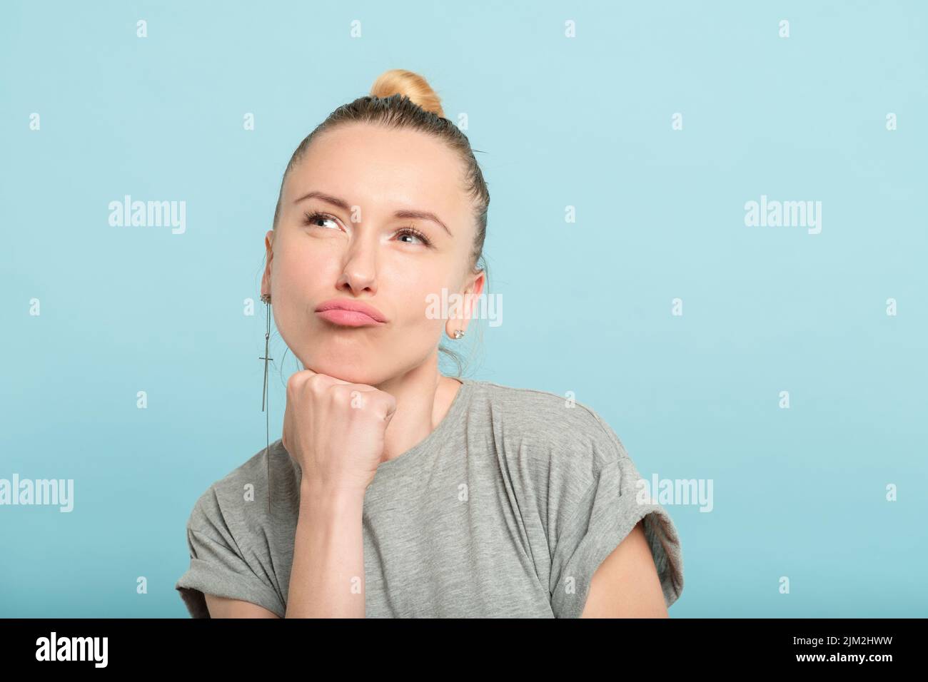 thoughtful woman pout duckface facial expression Stock Photo