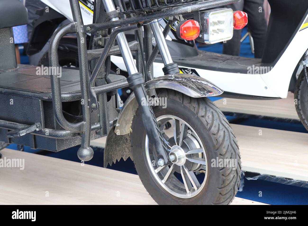 Front side view of a small goods or cargo carrying electric scooter Stock Photo