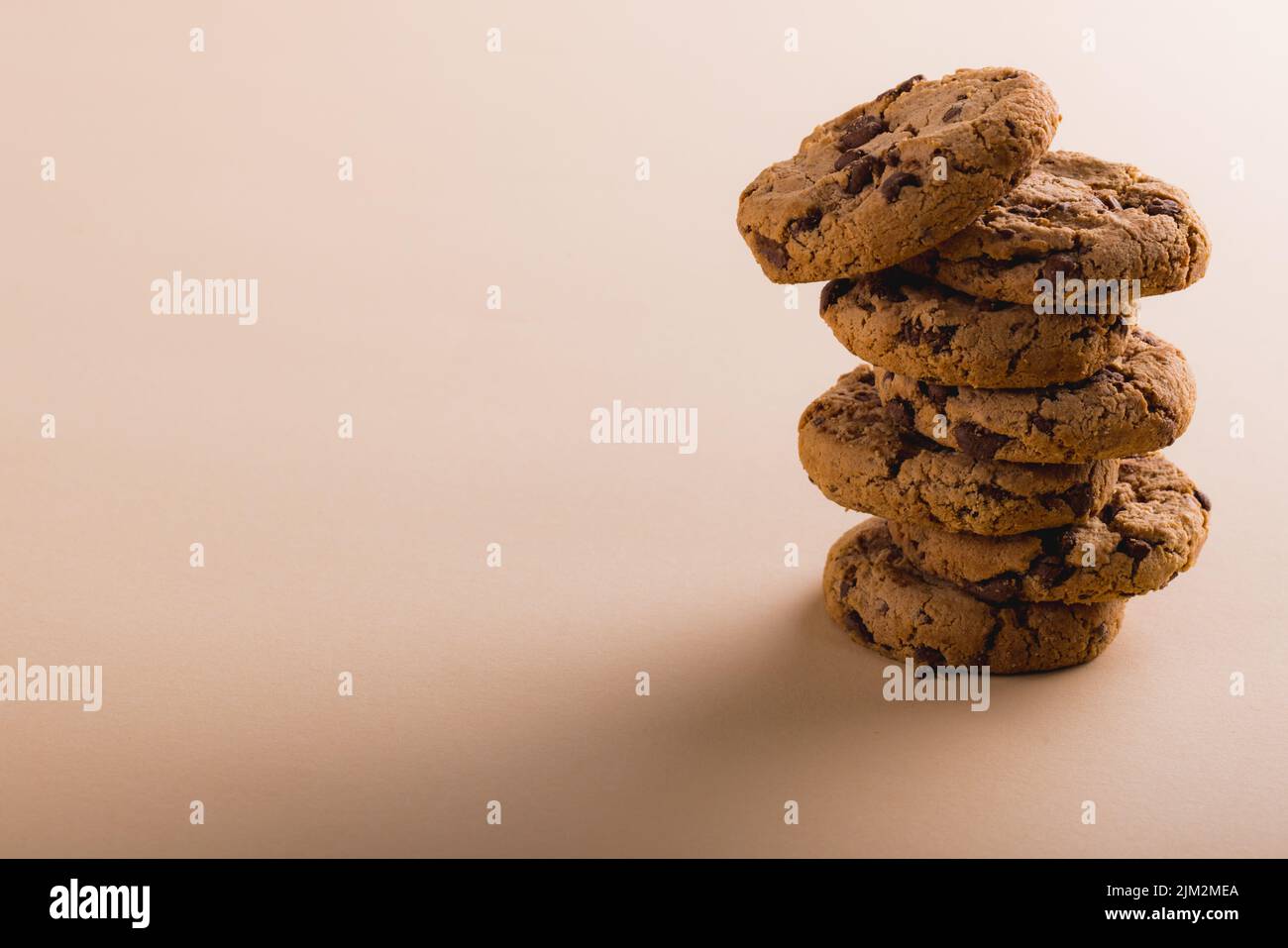 Stack of cookies on beige background with copy space Stock Photo