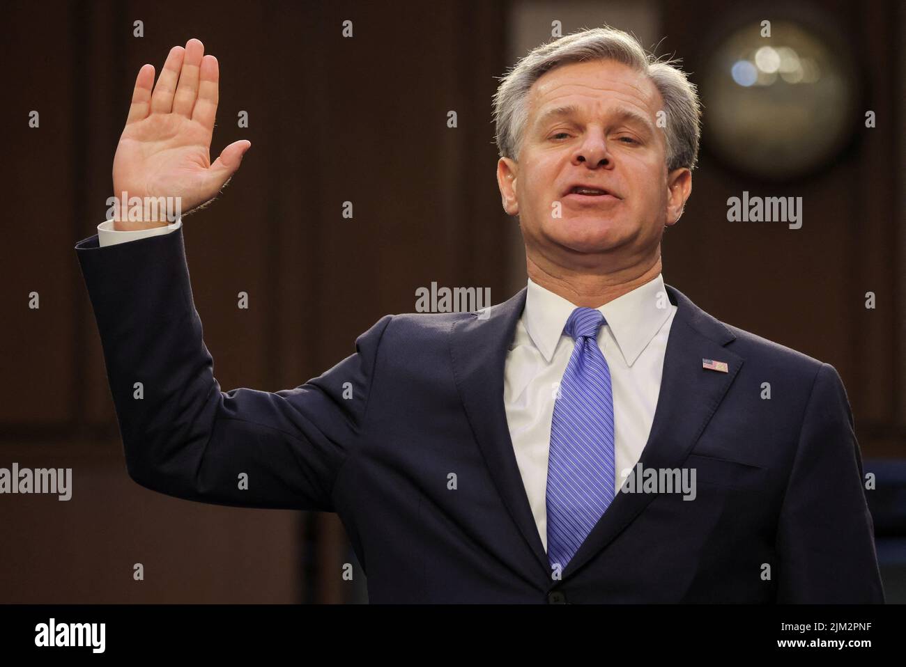 FBI Director Christopher Wray is sworn in to testify before a Senate Judiciary Committee hearing entitled 'Oversight of the Federal Bureau of Investigation,' on Capitol Hill in Washington, U.S. August 4, 2022. REUTERS/Jim Bourg Stock Photo