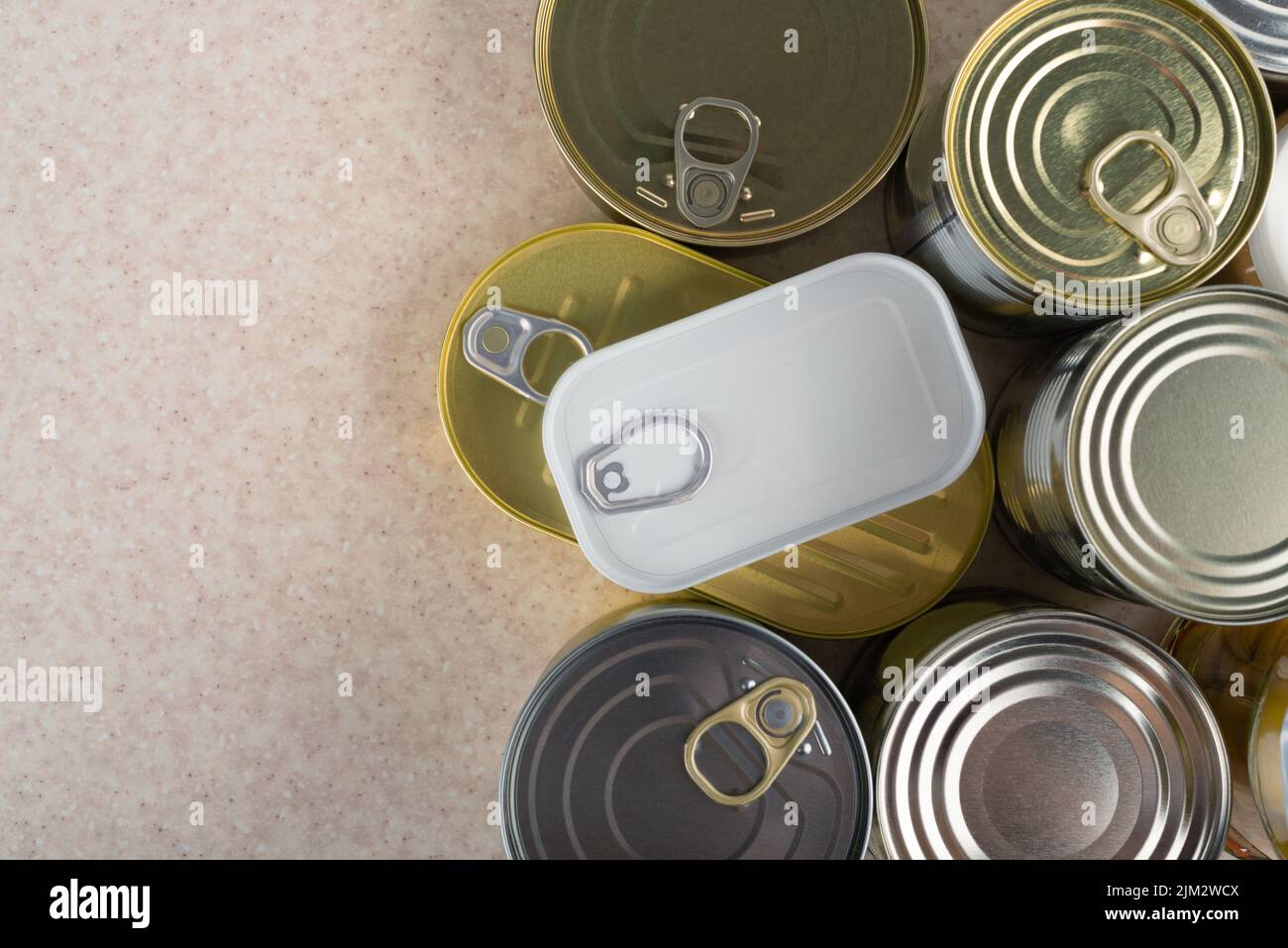 Tin cans on kitchen table background with copy space flat lay Stock Photo