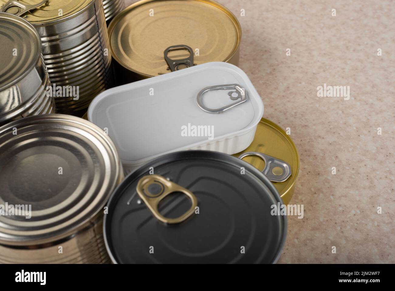 Tin cans on kitchen table background with copy space Stock Photo
