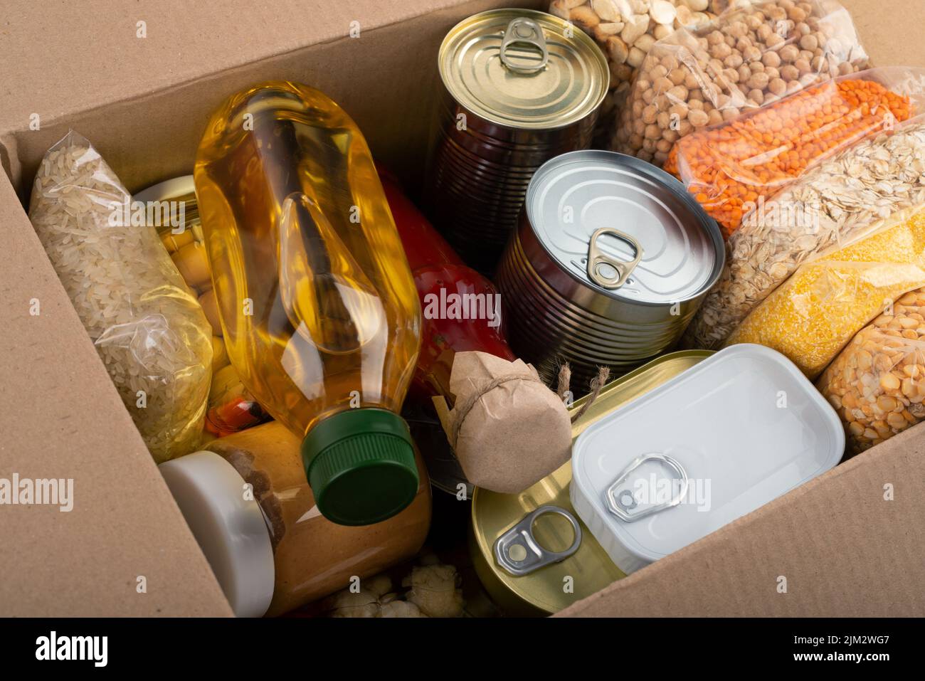 Survival set of nonperishable foods in carton box Stock Photo