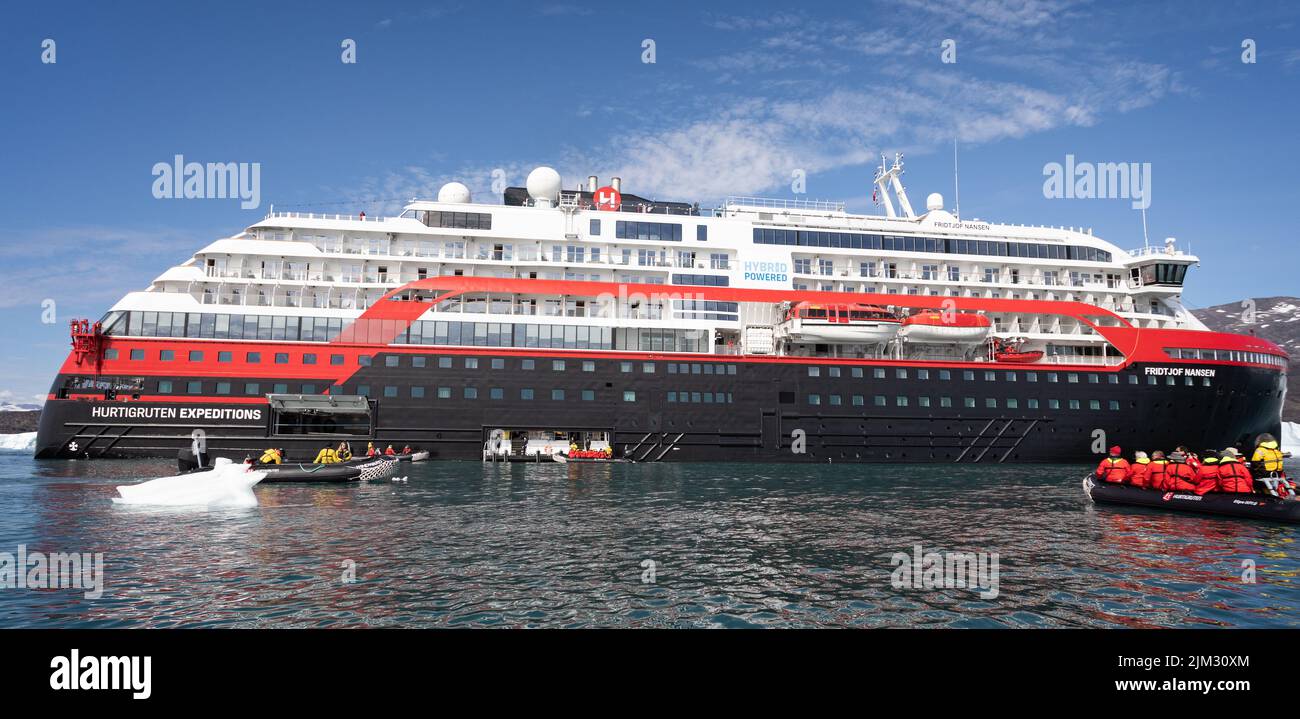 Close up of Hurtigruten's MS Fridtjof Nansen expedition cruise ship amidst icebergs with zodiacs off loading in Disko Bay, Greenland on 18 July 2022 Stock Photo