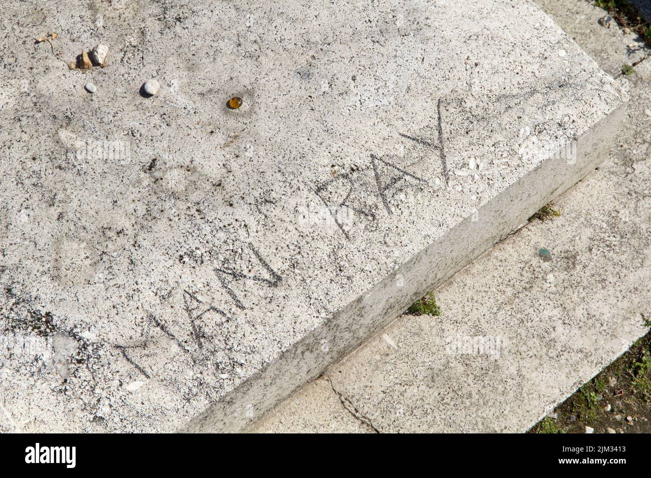 Surrealist artist Man Ray's tomb vandalized - detail - Montparnasse Cemetery -  Paris Stock Photo