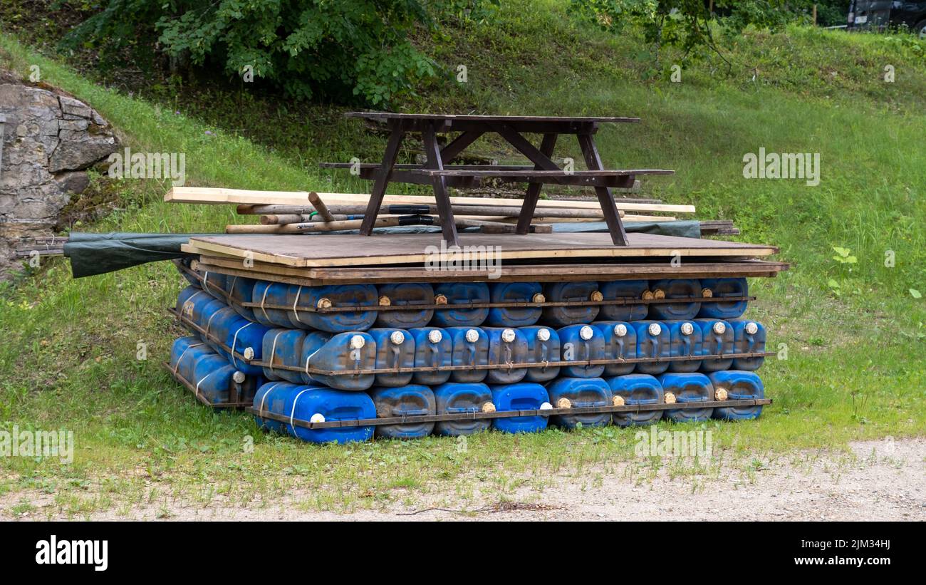 A raft made of plastic cans. Rafting down river Gauja in Latvia with