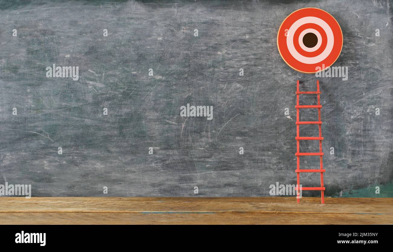 Stand out from the crowd and think different. Creative idea concepts with red ladder and ambitious target with copy space on blackboard Stock Photo