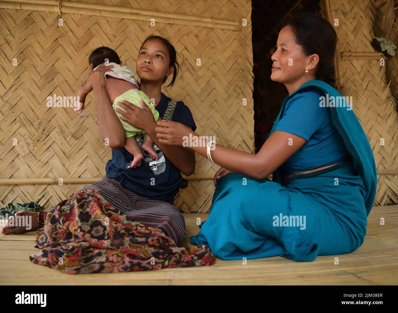 An accredited social health activist worker explains the benefit of ...