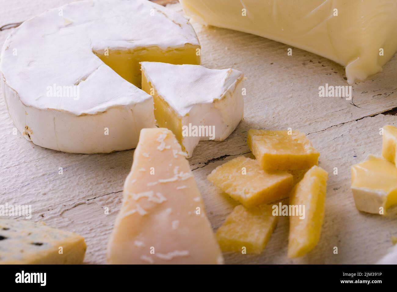 High angle view of various cheese on white table, copy space Stock Photo