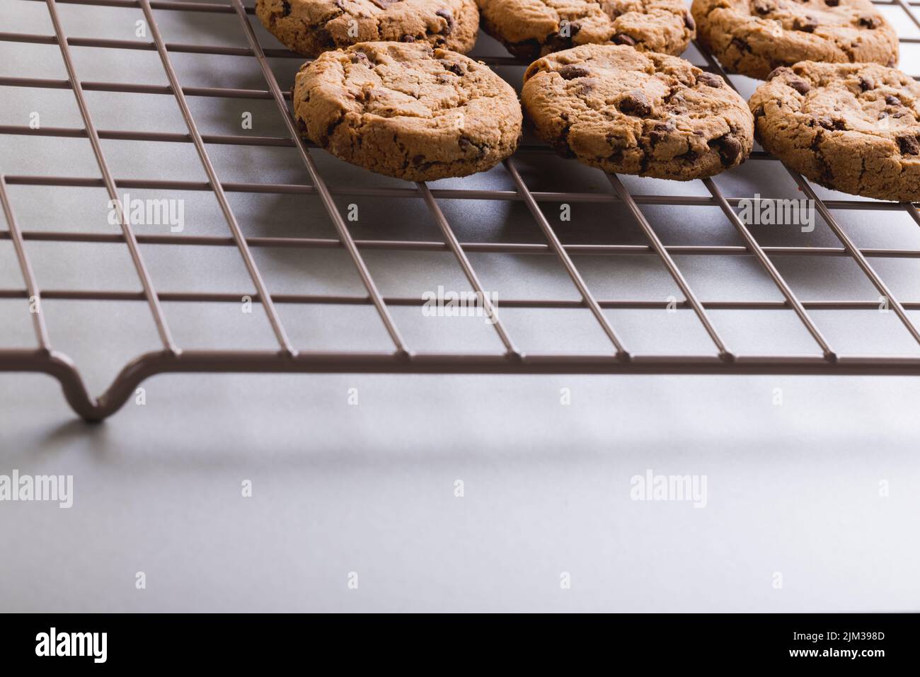 Close-up of fresh cookies on cooling rack at table, copy space Stock Photo