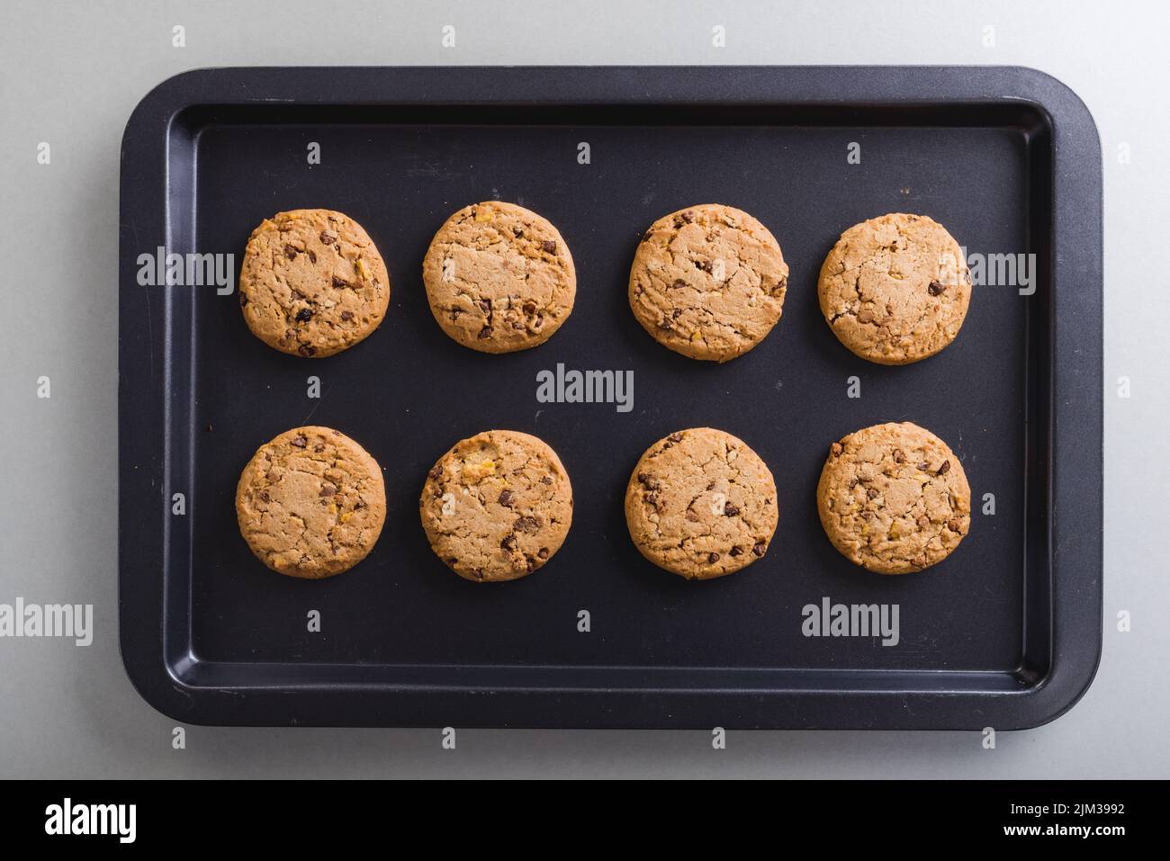 Directly above view of fresh cookies arranged in tray on table, copy space. unaltered, food, still life. Stock Photo