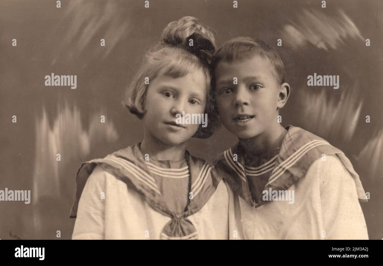 Vintage photo. Little 4-5-6 years  brother and sister dressed in sailor suits, Leningrad, (Petrograd),  USSR, Russia, 1924-1926 Stock Photo