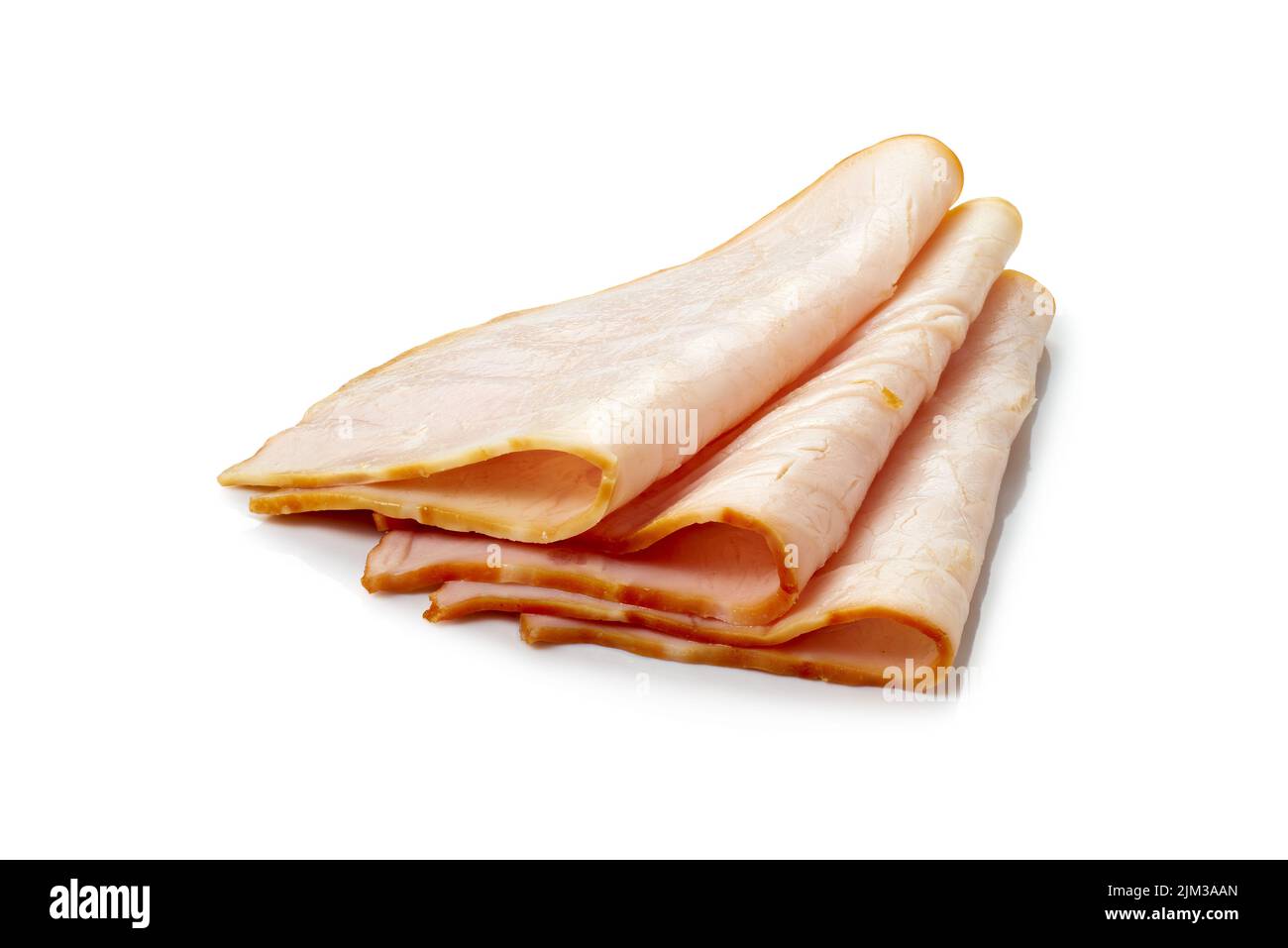 Three thin slices of ham folded on white background Stock Photo