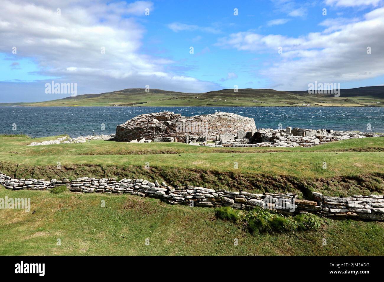 The Broch of Gurness and Eynhallow Sound. Stock Photo