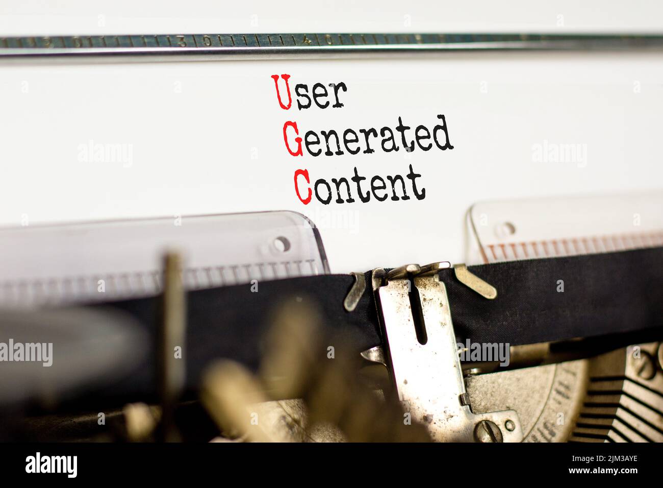 UGC user generated content symbol. Concept words UGC user generated content typed on the old retro typewriter on a beautiful white background. Busines Stock Photo