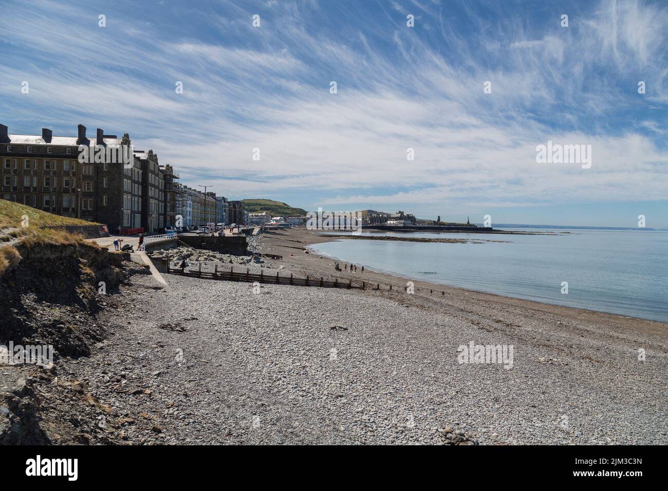 A view of the seafront apartments and hotels, and along the beach at Aberystwyth, Wales. Stock Photo