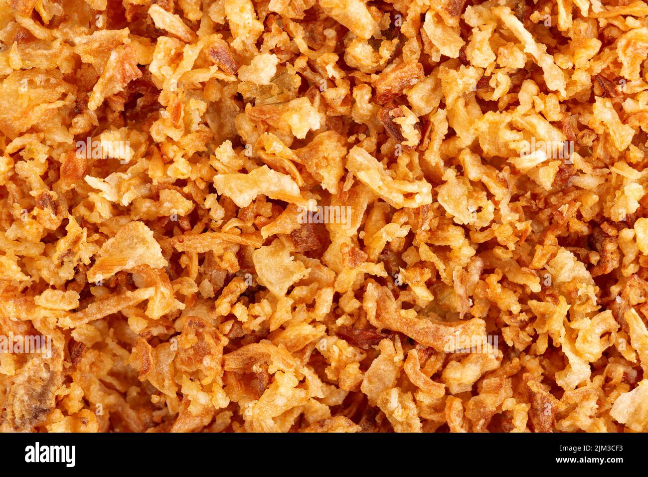 Roasted onions background. Crispy fried onions. Top view Stock Photo ...