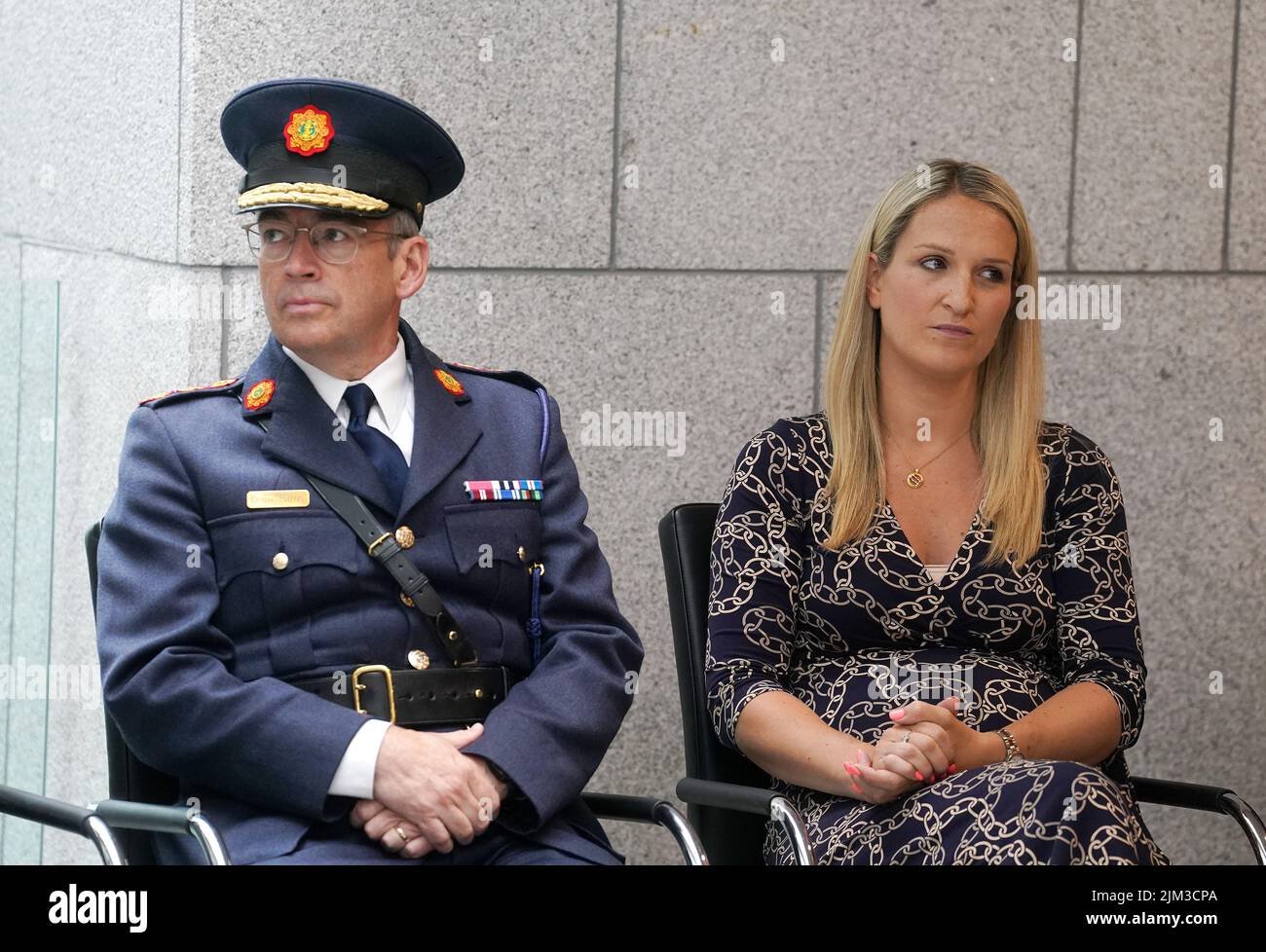 Garda Commissioner Drew Harris (left) with Minister for Justice Helen McEntee at a ceremony held by An Garda Síochána, as part of their Centenary Commemorations, to present serving and retired Garda personnel with a specially designed and produced Commemorative Centenary Medal/Coin. Picture date: Thursday August 4, 2022. Stock Photo