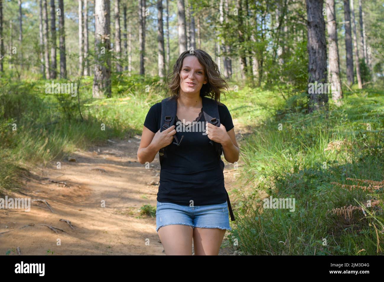 caucasian woman hiking in the french forest of Fontainebleau Stock ...