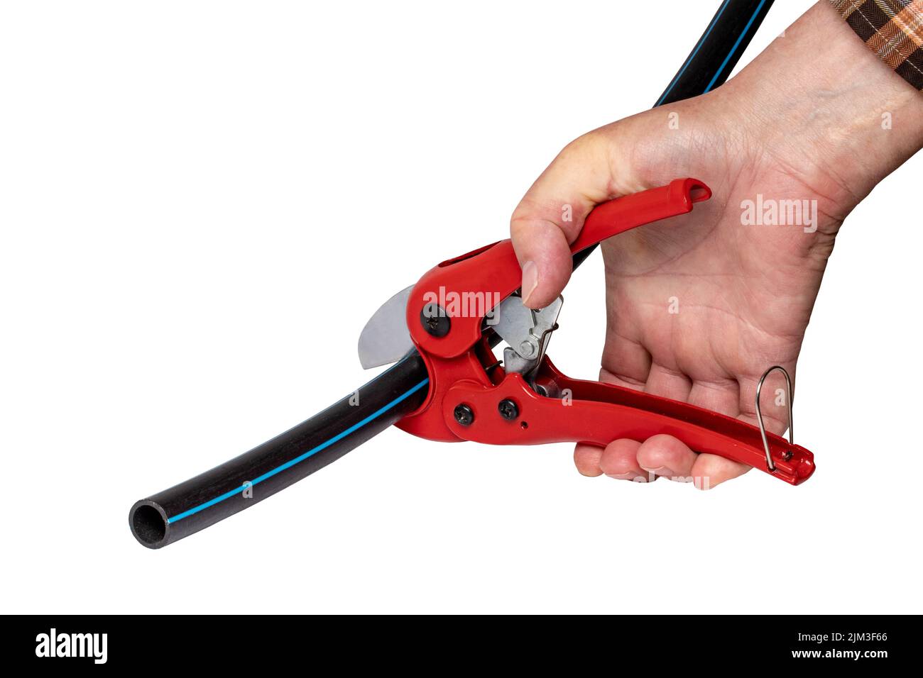 Plumber tools isolated. A man accurately cuts a piece of PE pressure